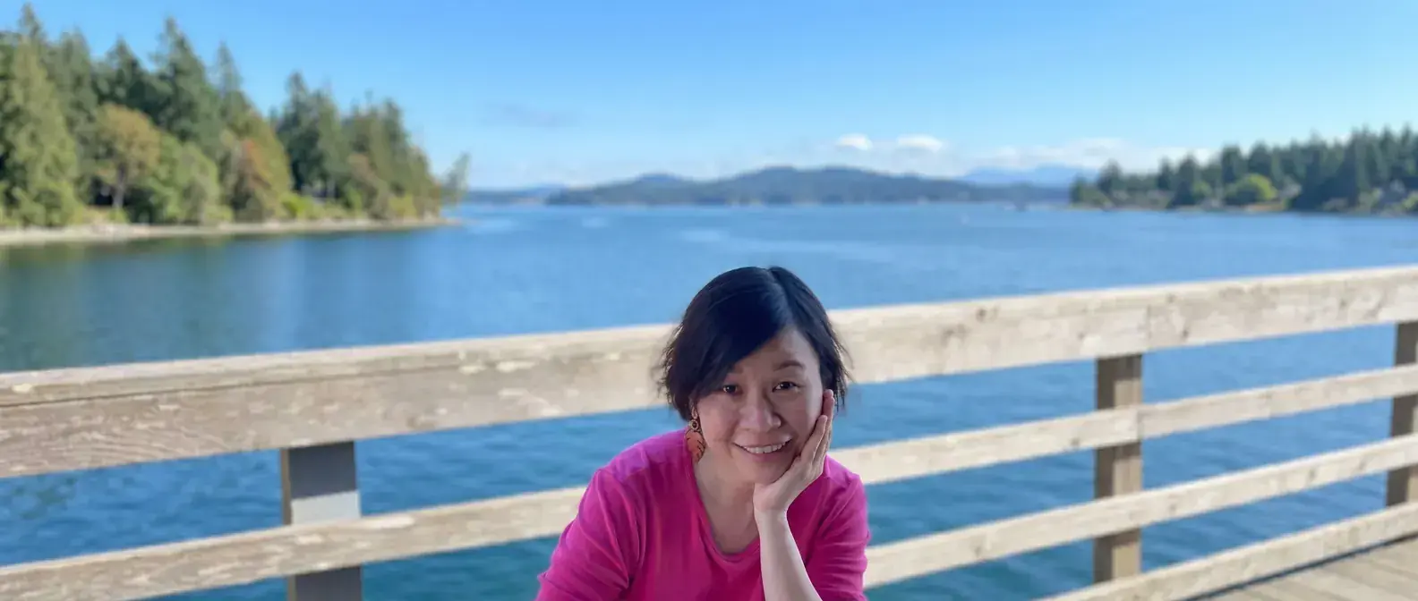Jackie Wu wearing a pink shirt